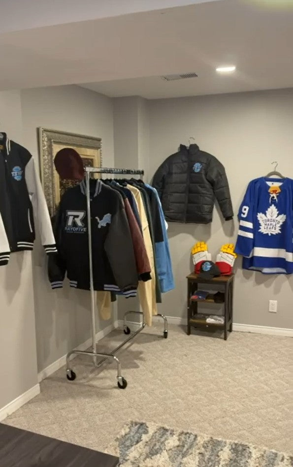 Custom varsity jackets, a puffer jacket, hockey gloves and a hockey jersey in the TSW showroom